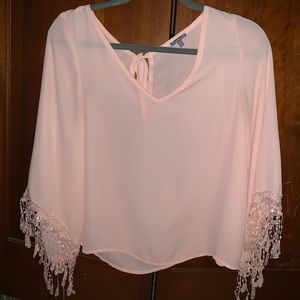 Light pink blouse with fringe on sleeves